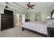 Spacious main bedroom with large bed, dresser, and access to the hallway at 164 Castlewood Rd, Tyrone, GA 30290