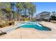 Inviting swimming pool with diving board, surrounded by a stone patio at 164 Castlewood Rd, Tyrone, GA 30290