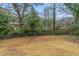 Backyard view, with trees and chain link fence at 37 Delmoor Nw Ct, Atlanta, GA 30311