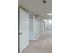 Unfinished basement with neutral walls and carpeted floor at 37 Delmoor Nw Ct, Atlanta, GA 30311