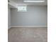 Bright basement room with a window and carpet at 37 Delmoor Nw Ct, Atlanta, GA 30311
