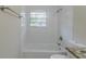 Clean bathroom with a shower/tub combo and granite countertop at 37 Delmoor Nw Ct, Atlanta, GA 30311