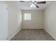 Bright bedroom with ceiling fan and neutral carpeting at 37 Delmoor Nw Ct, Atlanta, GA 30311