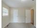 Large bedroom with neutral walls, carpet, and two doors at 37 Delmoor Nw Ct, Atlanta, GA 30311