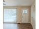 Bright entryway with white door and wood-look floors at 37 Delmoor Nw Ct, Atlanta, GA 30311