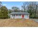 Charming ranch home with red front door and well-maintained lawn at 37 Delmoor Nw Ct, Atlanta, GA 30311