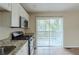 Eat-in kitchen with sliding door to patio access at 37 Delmoor Nw Ct, Atlanta, GA 30311