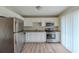 Modern kitchen with stainless steel appliances and granite counters at 37 Delmoor Nw Ct, Atlanta, GA 30311