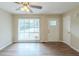 Spacious living room featuring wood-look floors and large window at 37 Delmoor Nw Ct, Atlanta, GA 30311