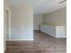 Open living space with wood-look floors and neutral walls at 37 Delmoor Nw Ct, Atlanta, GA 30311