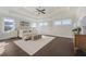 Spacious main bedroom with hardwood floors and ceiling fan at 1045 Coleman Place Dr, Roswell, GA 30075