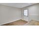 Unfinished basement featuring vinyl floors, a white door, and a wooden work table at 2025 Fife Ridge Ct, Roswell, GA 30075