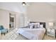Cozy bedroom featuring a vaulted ceiling, plush carpeting, and a large bed with soft, neutral-toned bedding at 2025 Fife Ridge Ct, Roswell, GA 30075