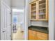 Convenient butler's pantry with cabinet storage, a countertop, and a doorway to another room at 2025 Fife Ridge Ct, Roswell, GA 30075
