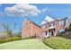 View of home's brick facade and manicured lawn, highlighting its curb appeal and architectural design at 2025 Fife Ridge Ct, Roswell, GA 30075