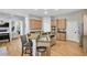 Open kitchen layout with stainless steel appliances, a breakfast bar, and views into the living room at 2025 Fife Ridge Ct, Roswell, GA 30075