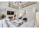 Spacious living room with fireplace, hardwood floors, vaulted ceilings, and a second-floor overlook at 2025 Fife Ridge Ct, Roswell, GA 30075