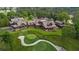Stunning aerial view of sprawling estate on golf course with manicured lawns and mature trees at 918 Big Horn Holw, Suwanee, GA 30024