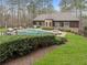 Stunning backyard features a swimming pool, hot tub, lush greenery, and patio furniture for relaxation at 918 Big Horn Holw, Suwanee, GA 30024