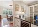 Convenient bar area with a wine cooler adjacent to the formal dining room at 918 Big Horn Holw, Suwanee, GA 30024