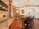 Custom wet bar featuring stylish seating, warm wood finishes, and ample storage space, perfect for entertaining guests at 918 Big Horn Holw, Suwanee, GA 30024