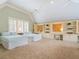 Bright bedroom with two twin beds, carpeted floor, built in cabinets, and vaulted ceilings at 918 Big Horn Holw, Suwanee, GA 30024