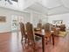 Hardwood floors dining room featuring a table with seating and plenty of natural light at 918 Big Horn Holw, Suwanee, GA 30024