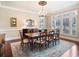 Bright dining room with plantation shutters and a classic chandelier at 918 Big Horn Holw, Suwanee, GA 30024