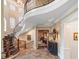 Impressive foyer with curved staircase, hardwood floors, and sophisticated decor at 918 Big Horn Holw, Suwanee, GA 30024