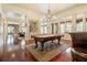 Game room featuring a pool table, bar area, and ample space for recreation and entertainment at 918 Big Horn Holw, Suwanee, GA 30024