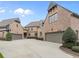 Spacious garages with ample parking space and a well-maintained driveway at 918 Big Horn Holw, Suwanee, GA 30024