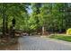 Elegant stone and wrought iron gated entrance to a private community at 918 Big Horn Holw, Suwanee, GA 30024