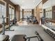 Well-equipped home gym with exercise machines, mirrors, and natural light for fitness activities at 918 Big Horn Holw, Suwanee, GA 30024
