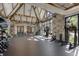 Spacious gym with stone accent wall, high ceilings, and an abundance of natural light at 918 Big Horn Holw, Suwanee, GA 30024