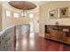 Bright hallway with hardwood floors, traditional lighting, and built-in shelving, offering a glimpse of the home's charm at 918 Big Horn Holw, Suwanee, GA 30024