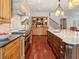 Gourmet kitchen features a large center island, custom cabinets, and professional-grade appliances at 918 Big Horn Holw, Suwanee, GA 30024