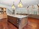 Gourmet kitchen features a large center island, custom cabinets, and professional-grade appliances at 918 Big Horn Holw, Suwanee, GA 30024