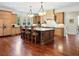 Gourmet kitchen features a large center island, custom cabinets, and professional-grade appliances at 918 Big Horn Holw, Suwanee, GA 30024