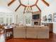 Vaulted living room with fireplace, stone surround and large picture windows with views of the backyard at 918 Big Horn Holw, Suwanee, GA 30024
