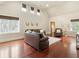 Large upstairs bonus room with hardwood floors, comfortable seating, and natural light, perfect for relaxation and entertainment at 918 Big Horn Holw, Suwanee, GA 30024