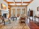 Elegant living room with coffered ceilings, a fireplace, and french doors at 918 Big Horn Holw, Suwanee, GA 30024