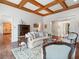 Cozy living room featuring coffered ceiling, neutral color palette, and sophisticated furnishings at 918 Big Horn Holw, Suwanee, GA 30024