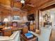 This office has custom wood trim, an ornate ceiling, and large desk with custom cabinets at 918 Big Horn Holw, Suwanee, GA 30024