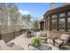 Expansive outdoor patio with seating area, perfect for enjoying the view of the backyard and surrounding greenery at 918 Big Horn Holw, Suwanee, GA 30024