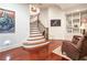 Beautiful staircase with hardwood steps, iron railing, and decorative details, creating a grand and welcoming entrance at 918 Big Horn Holw, Suwanee, GA 30024