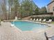 Large, pristine pool with a basketball hoop, hot tub, and ample deck space for lounging at 918 Big Horn Holw, Suwanee, GA 30024