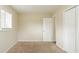 Bright bedroom with neutral walls, carpet, and ample closet space at 2211 Green Forrest Dr, Decatur, GA 30032