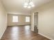 Spacious dining room with hardwood-look vinyl flooring and access to living room at 2211 Green Forrest Dr, Decatur, GA 30032