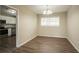 Bright dining area with hardwood-look vinyl flooring and kitchen access at 2211 Green Forrest Dr, Decatur, GA 30032