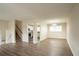 Open concept dining room with hardwood-look vinyl flooring and kitchen view at 2211 Green Forrest Dr, Decatur, GA 30032